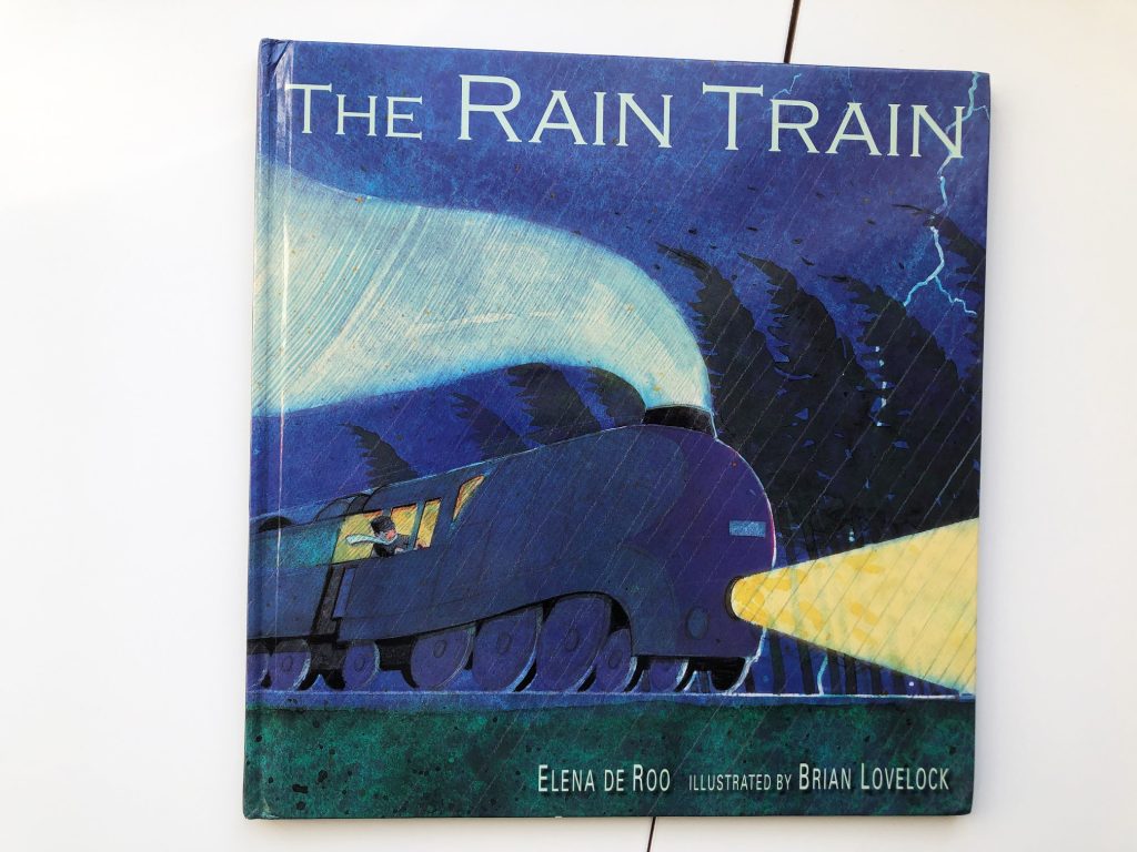 Cover with a train driving through the rain. A Rollicking Ride to Fall Asleep on The Rain Train