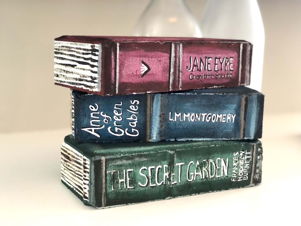 A stack of bricks painted to look like books.