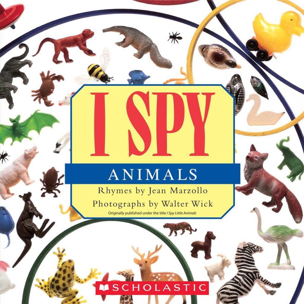 Book cover with plastic animal toys.